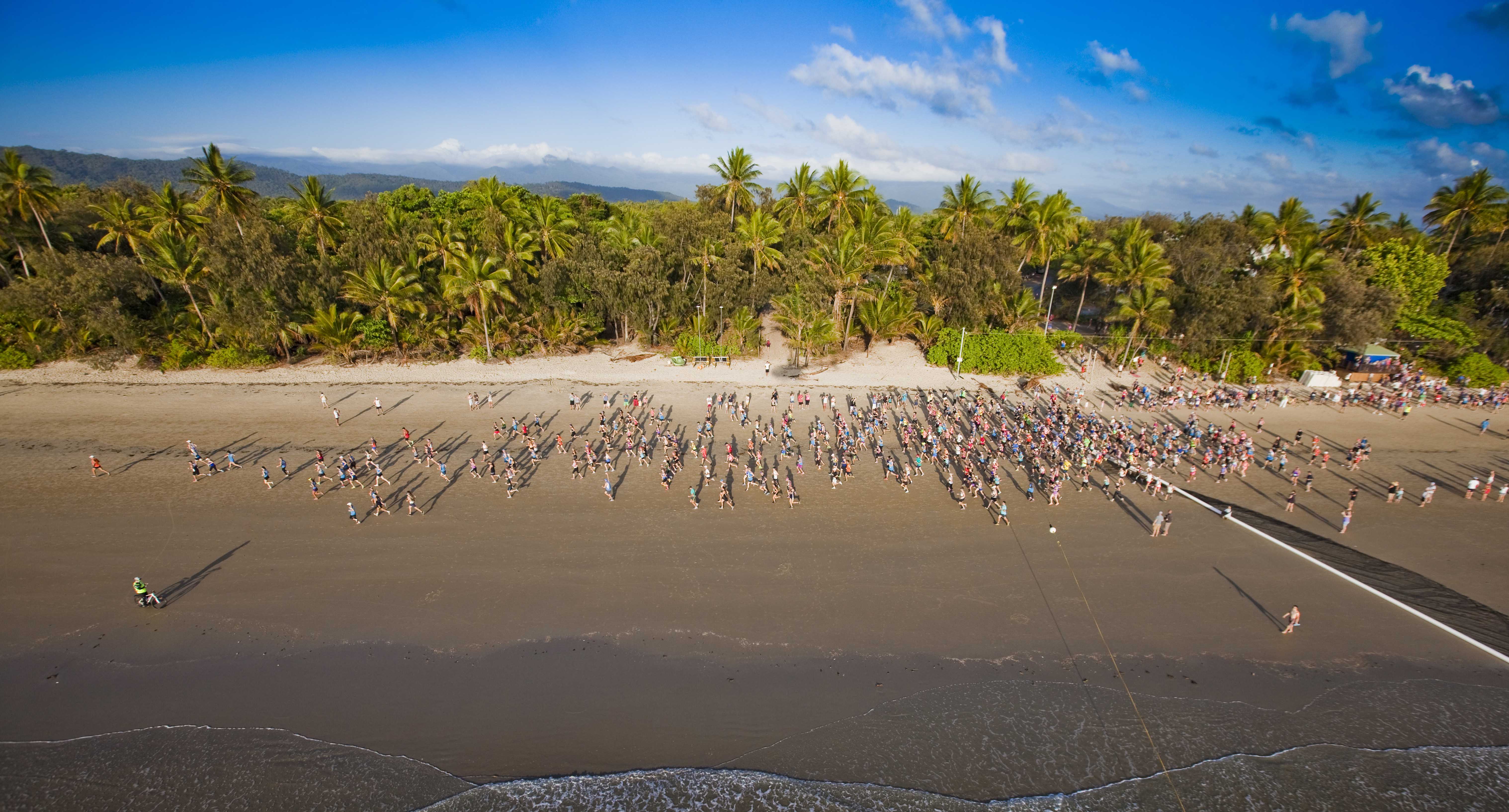 Aerial photo of runners on Four Mile Beach Port Douglas